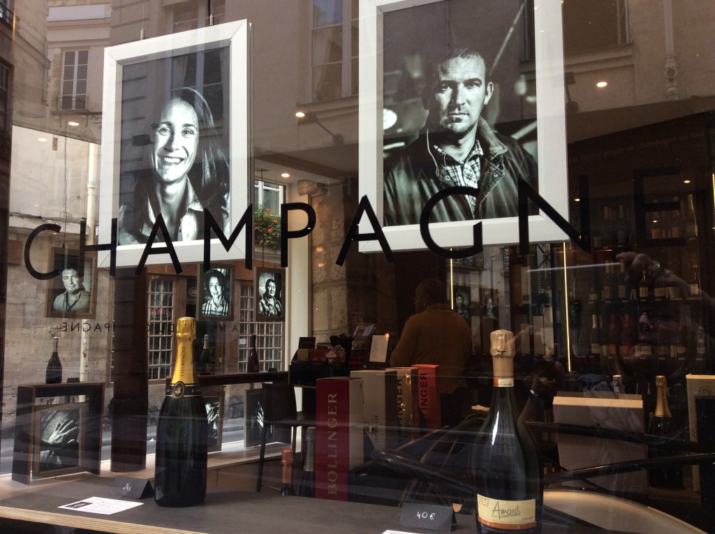 window displaying champagne makers at Dillettantes Maison du Champagne in Paris